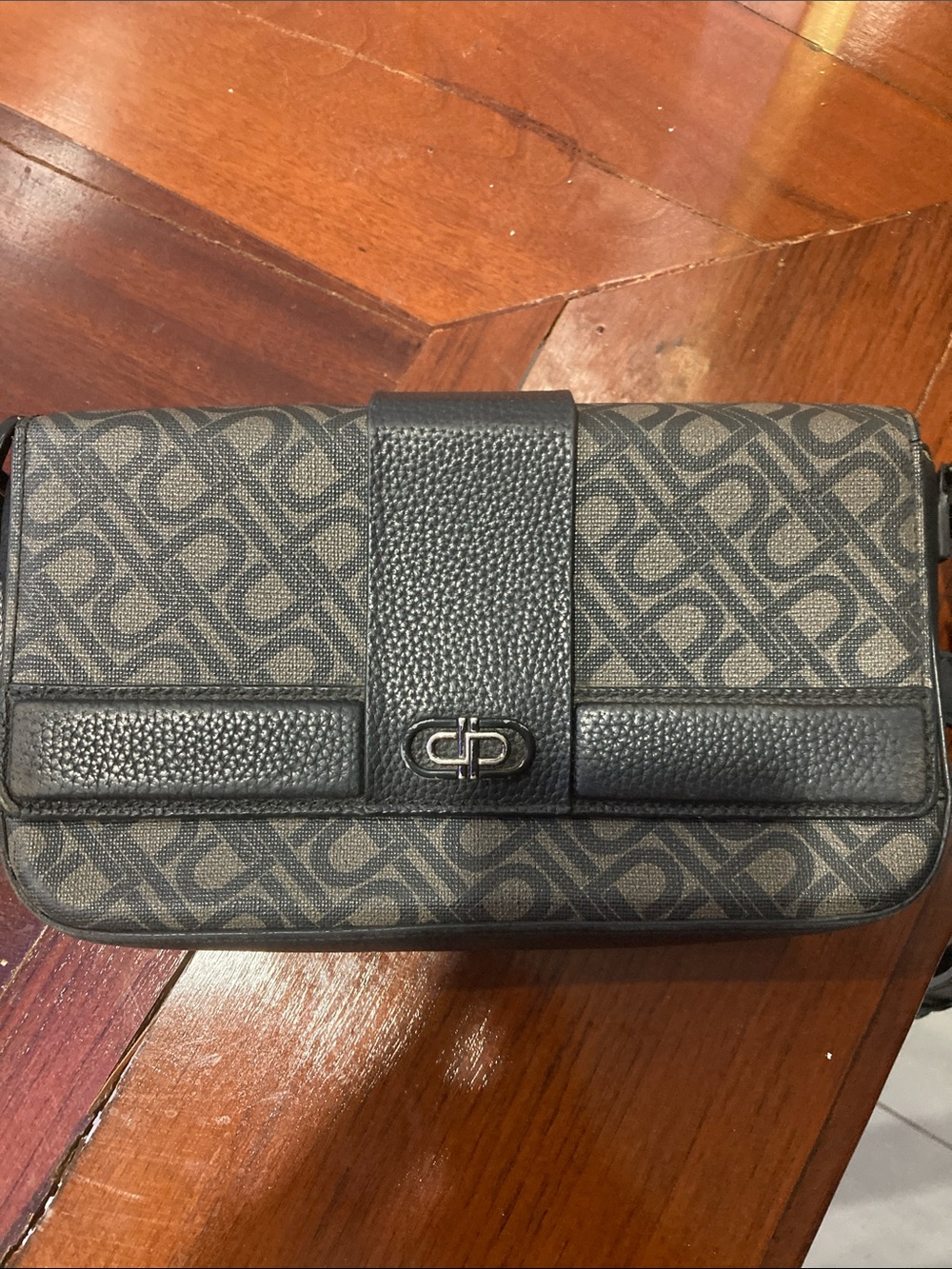 A pre-owned bag that is still in like-new condition.